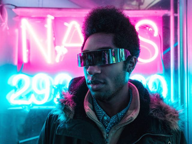 man with wraparound shades on