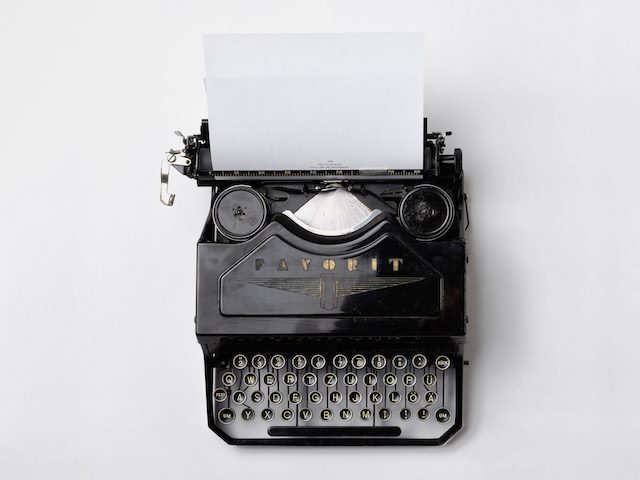 typewriter with a paper in it, the beginning of a book?