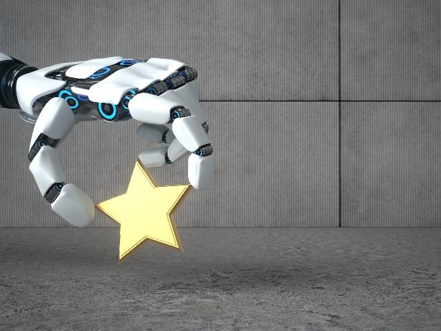 A robot hand holds and lifts one gold customer rating star against a gray background, illustrating the problem of fake reviews and bot reviews. 