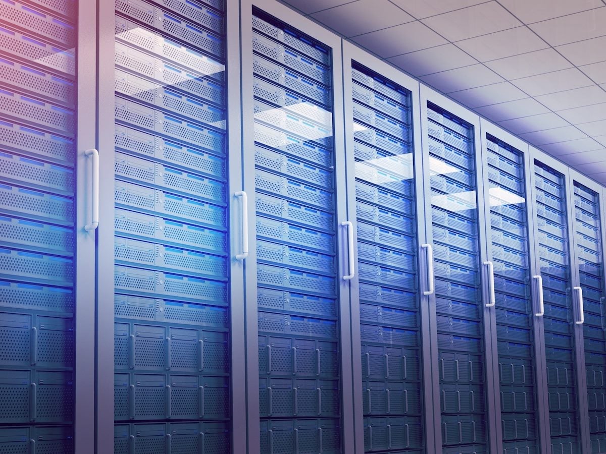 Hallway with row of tower servers