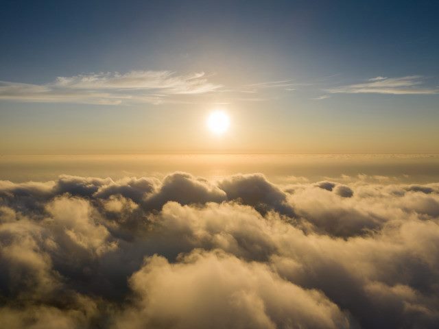 A clear sunset above clouds.