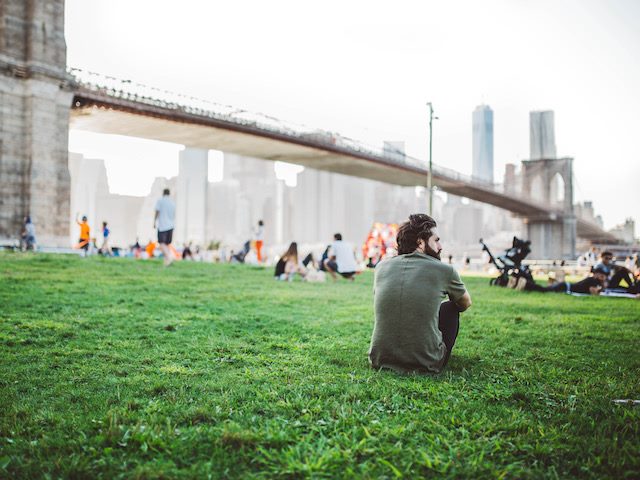 man people watching in a Brooklyn park