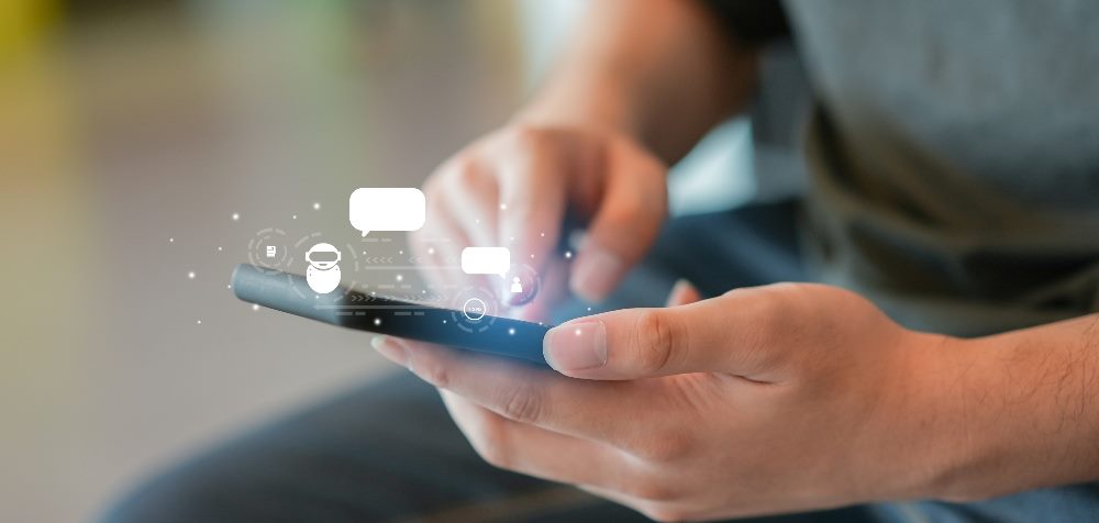 A man use smartphone to contact provider and talk with ai chatbot software program, suggesting the power of chatbots in customer service.