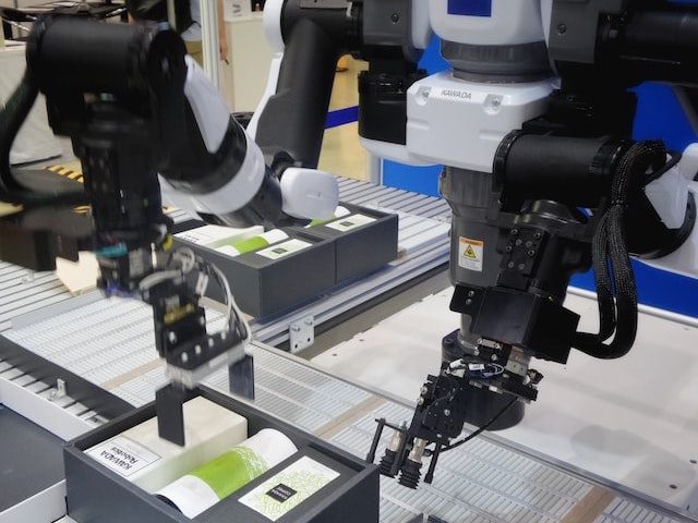 Two robotic arms operating
