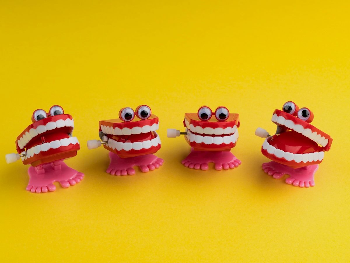 a group of chatter teeth toys, all with googly eyes