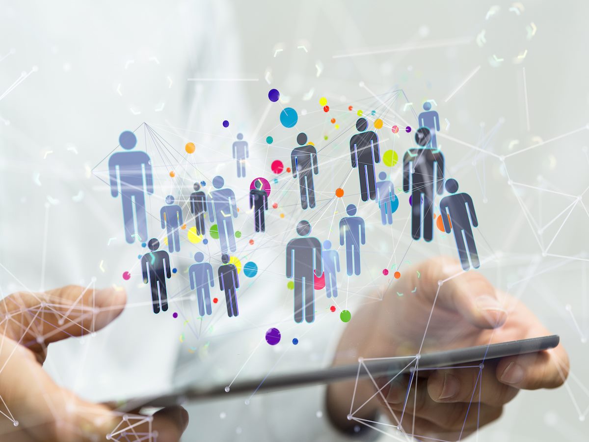 An illustration of outlines of people hovering above a smart tablet