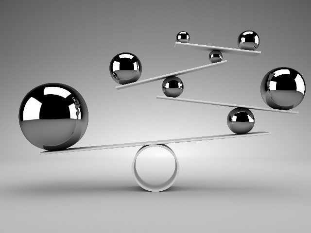 Shiny silver metal balls are balancing on a series of seesaw--like contraptions rising high and resting on a circle base in piece about the impact of AI on SEO. 