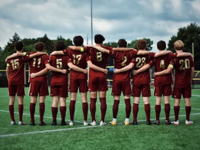 A sports team lined up on a field
