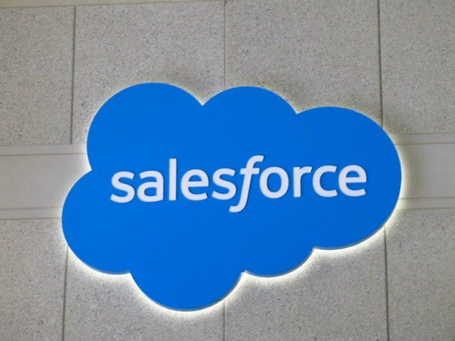 Salesforce logo on a wall.