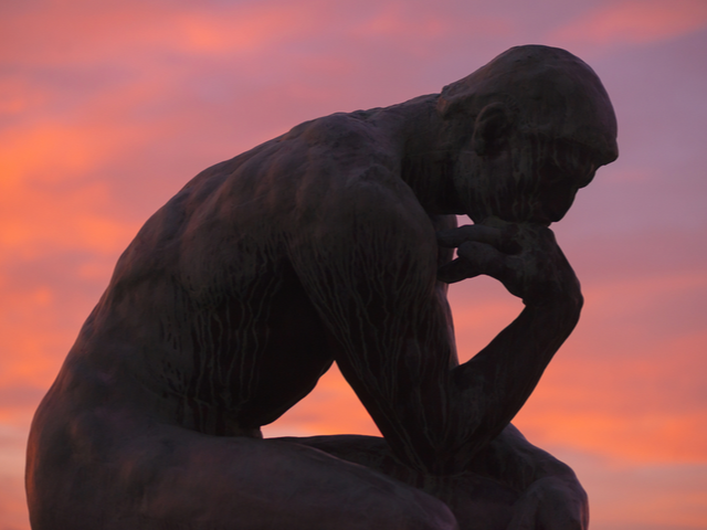 Sculpture of the thinker of Rodin at Waldermarsudde at sunset 