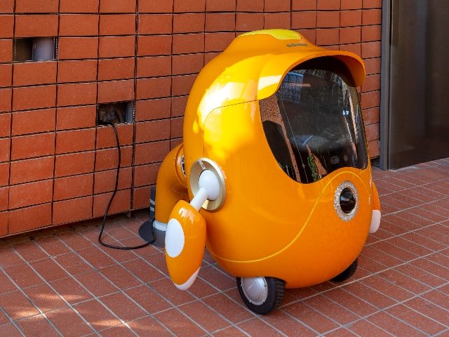 Cute robot Opti, the guardian of the opportunity pavilion on charge at Expo 2020 in Dubai.