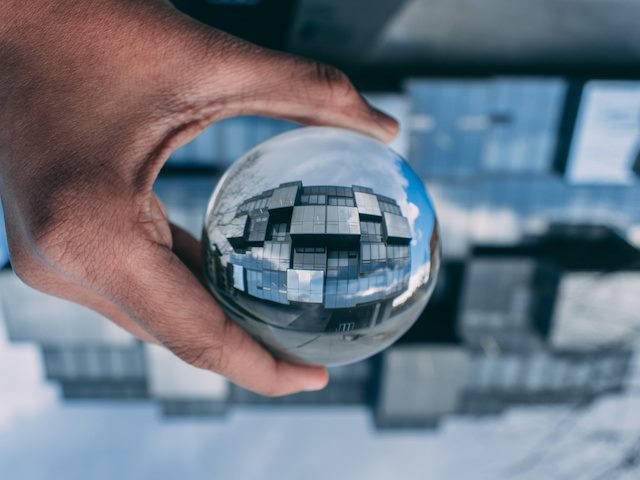 looking through a glass globe to depict multiple dimensions