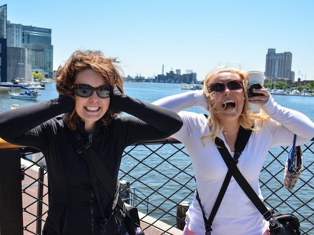 two women covering their ears