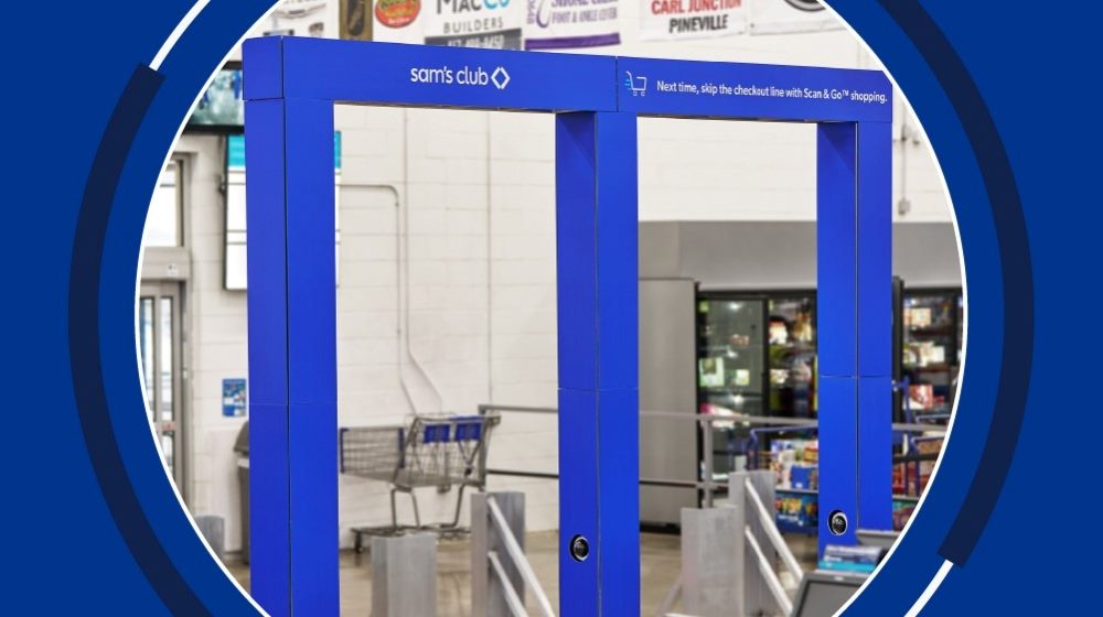 An image of a Sam's Club store entrance featuring an AI-powered receipt checker system. The system consists of a blue, rectangular frame with the Sam's Club logo and a message encouraging the use of the Scan & Go shopping app to skip the checkout line. The frame is installed near the store's exit, with shopping carts and product displays visible in the background. The overall setting appears to be inside a warehouse-style retail environment in piece about AI in customer experience.