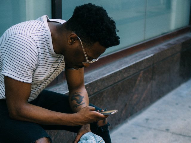 reading news on phone