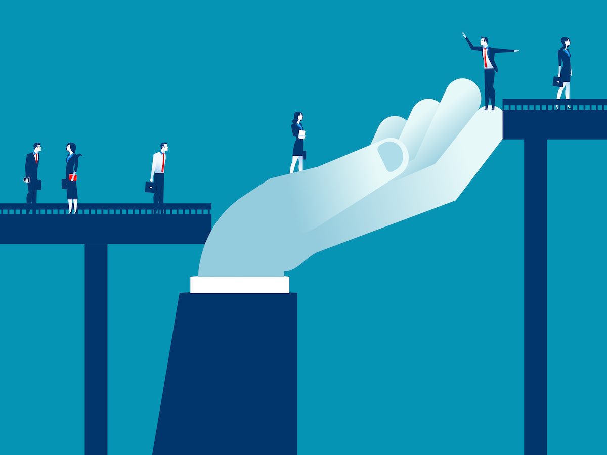Big hand supporting business people to walk across gap