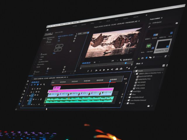 Adobe Premiere Pro video editing software open on a laptop computer.
