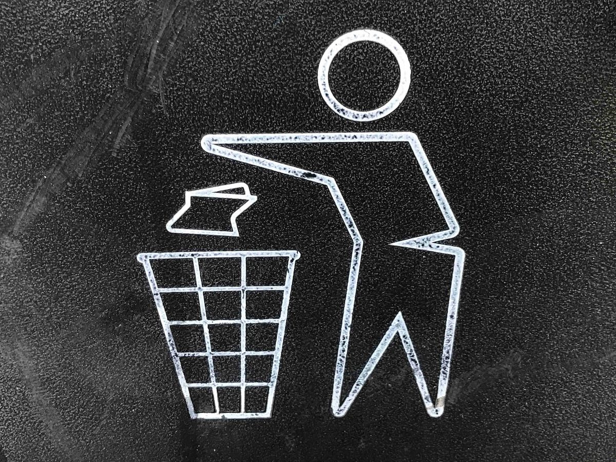 drawing of a figure throwing out a piece of trash