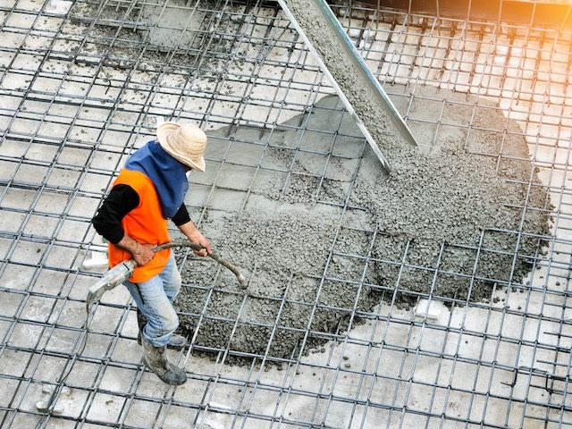 pouring concrete foundation at a work site
