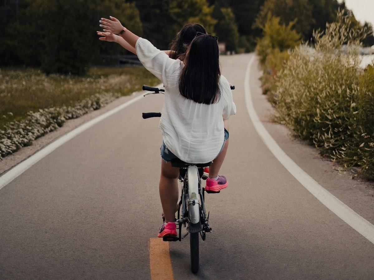 riding a bicycle in tandem