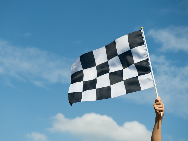 A racing flag held in the air