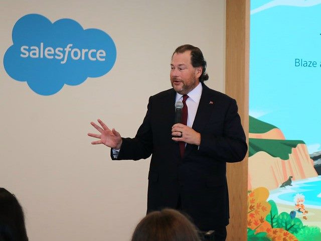 Salesforce CEO Marc Benioff speaking to a crowd of people.