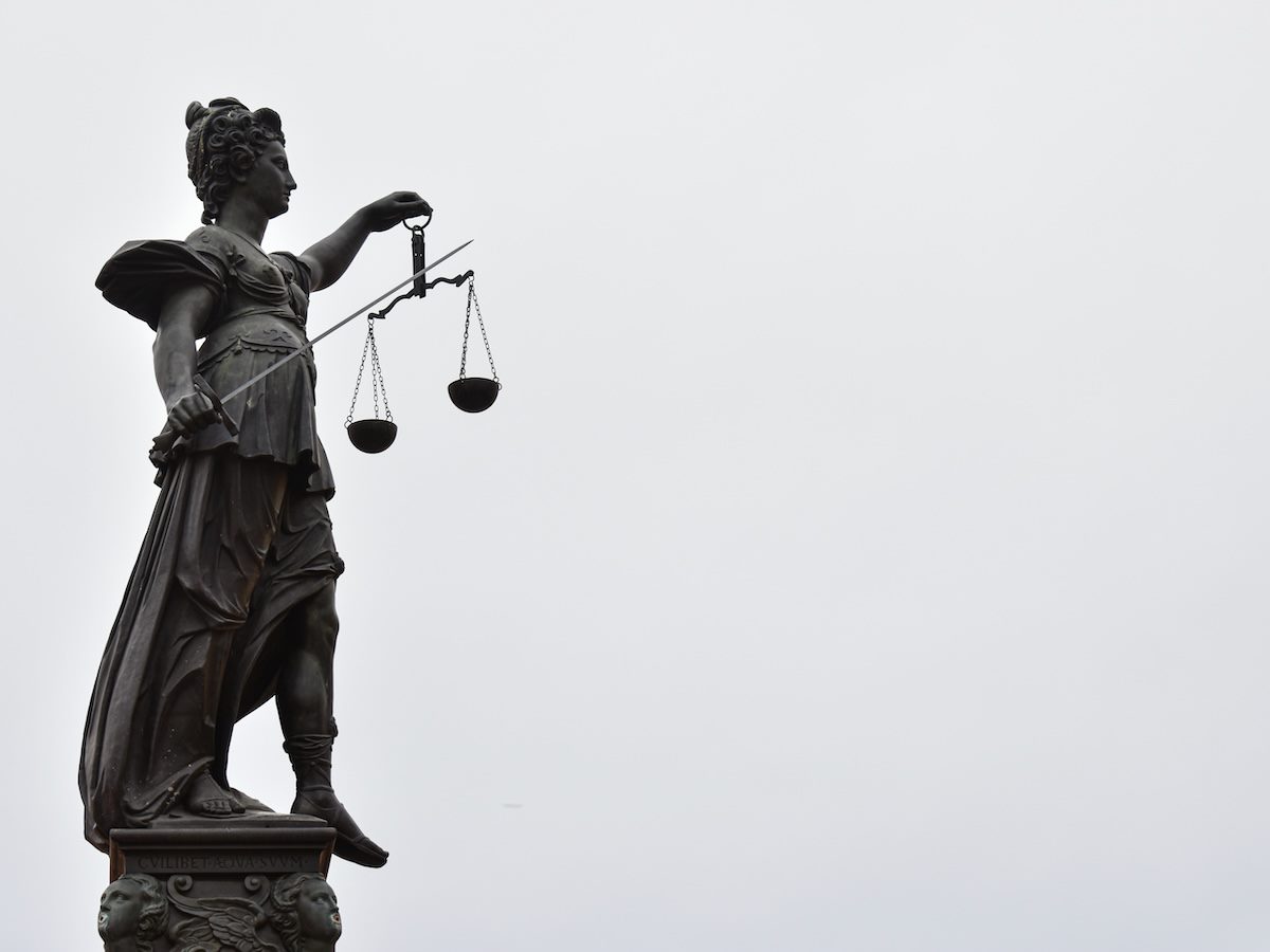 statue holding scales of justice