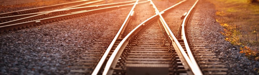Railway track switches in the evening in sunlight in piece about the Perplexity AI ad strategy.