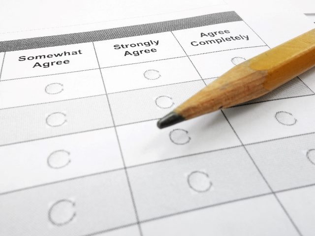 Survey form with a pencil on it, symbolizing customer experience metrics and how generative AI can boost your scores. 