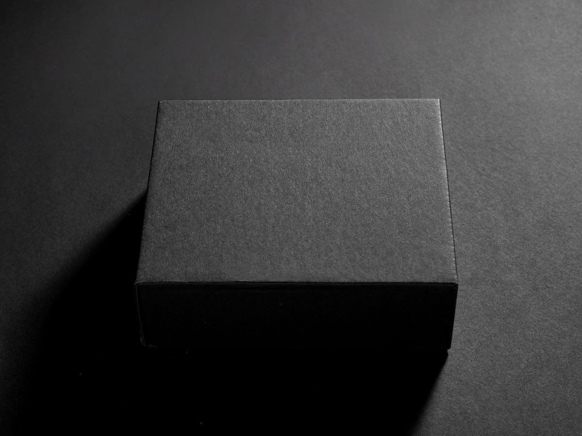 Empty black box on black background