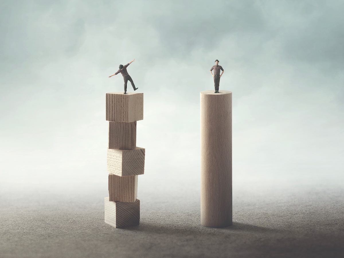 a graphic of what looks like two mimes standing on two different towers, one firm footing one on a faulty construction