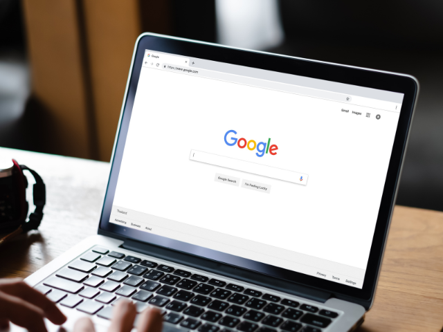 A laptop with Google Search open on the screen