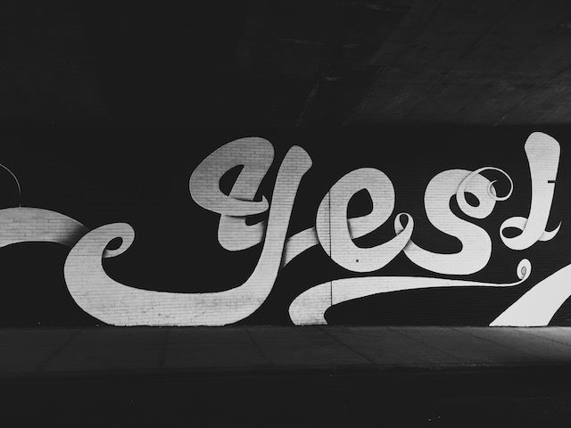 yes painted  on a wall