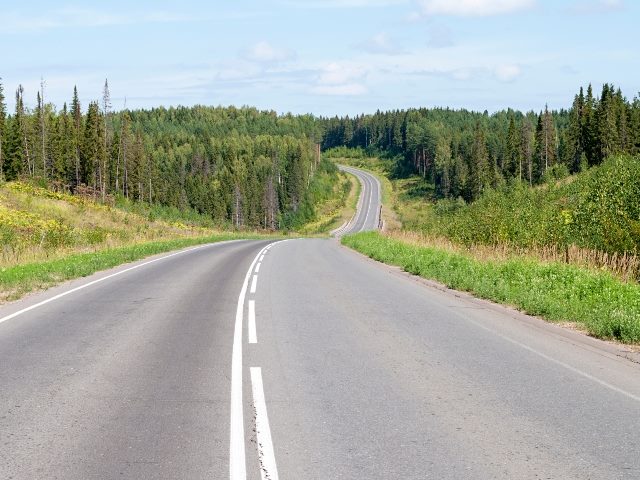 Asphalt road through the hills.