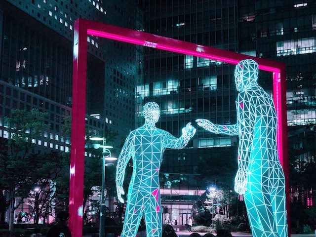 two figures touching, public art installation
