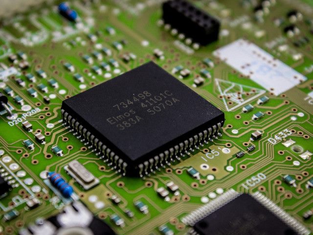 An integrated circuit IC chip on a PCB.