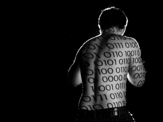 boxer with code projected on his back