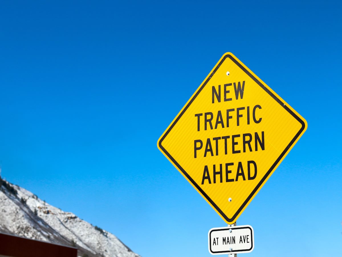 New Traffic Pattern Ahead yellow diamond street sign