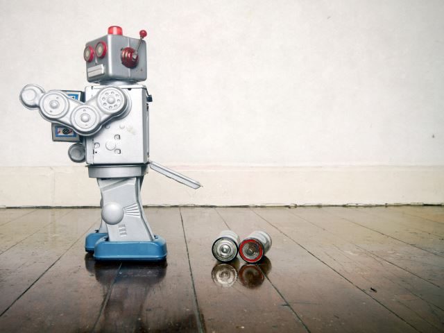 A robot toy that lost its batteries - artificial intelligence business failure concept