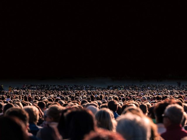  Panoramic photo of large crowd of people, illustrating the need for human centered AI.
