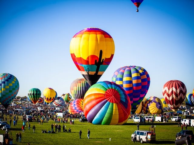 Hot air balloons at a outdoor festival 