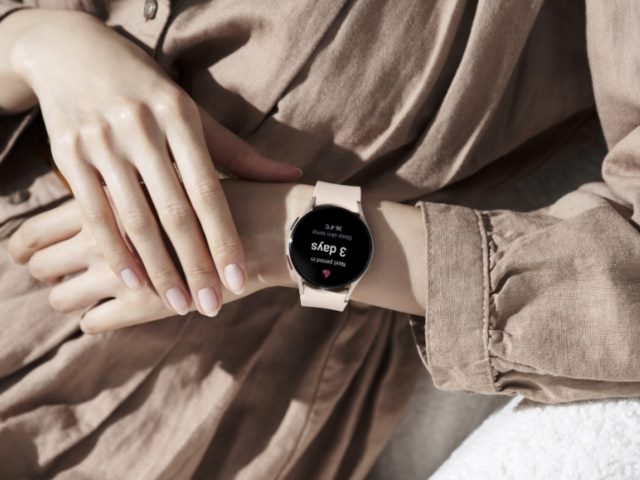A person wears a Samsung Galaxy Watch on their wrist.