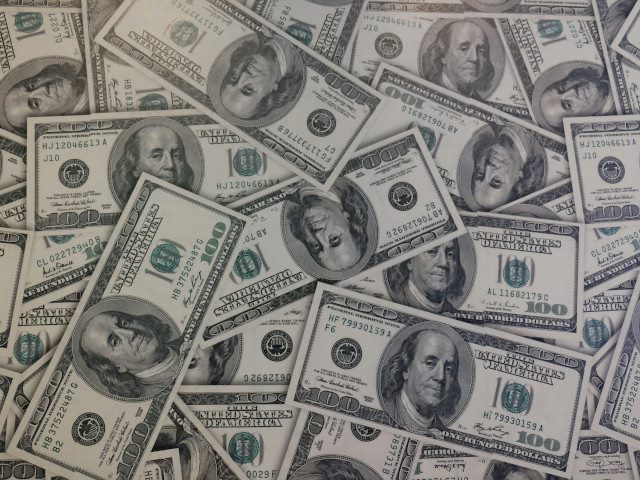 A group of 100 dollar bills of cash.