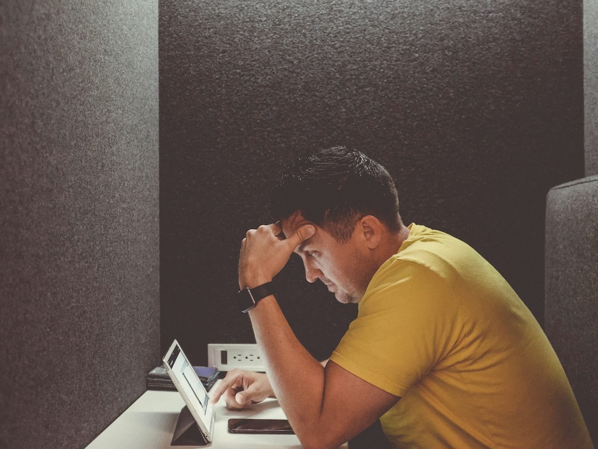frustrated worker in cubicle