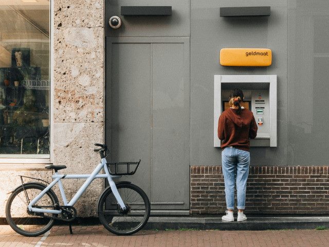 A customer uses a bank ATM.