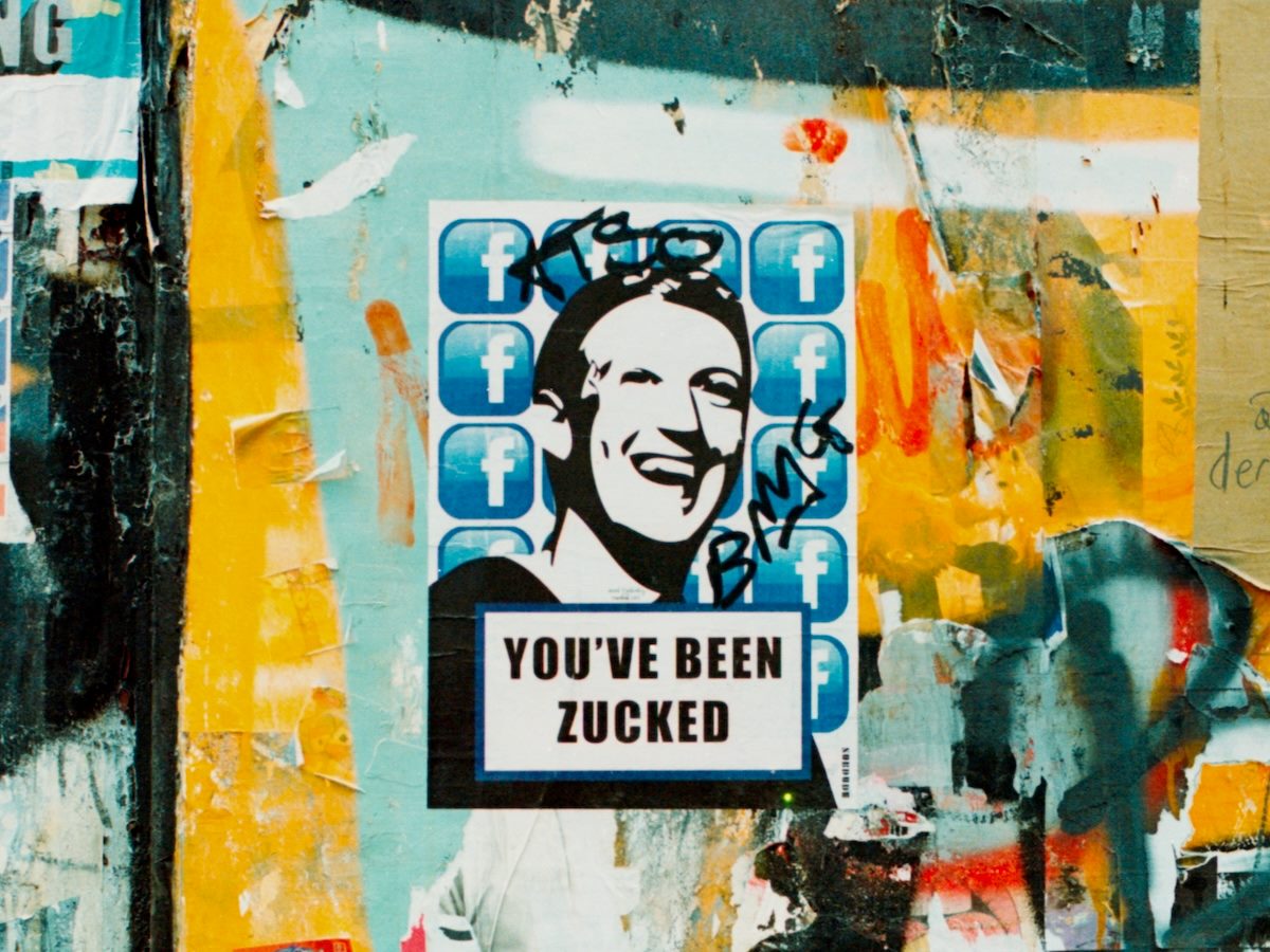 pasteup graffiti with Mark Zuckerberg's face. Text reads: "You've been Zucked"