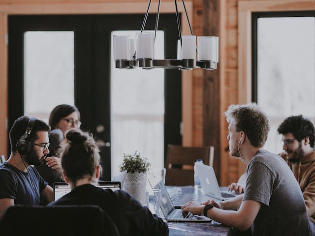 people working at a table 