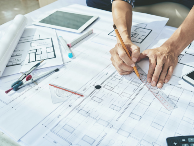 A person working on a blueprint