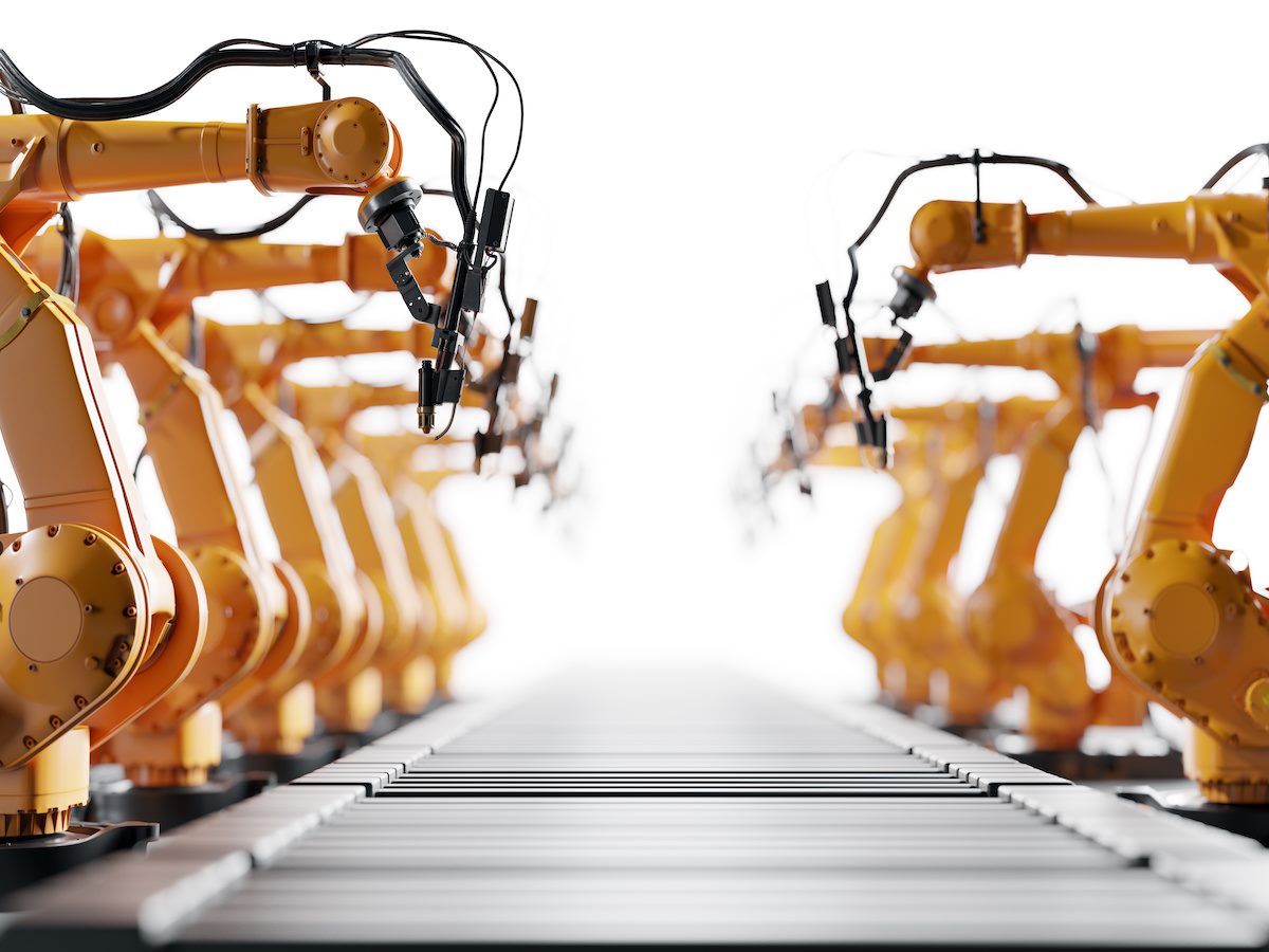 Robotic arms along assembly line