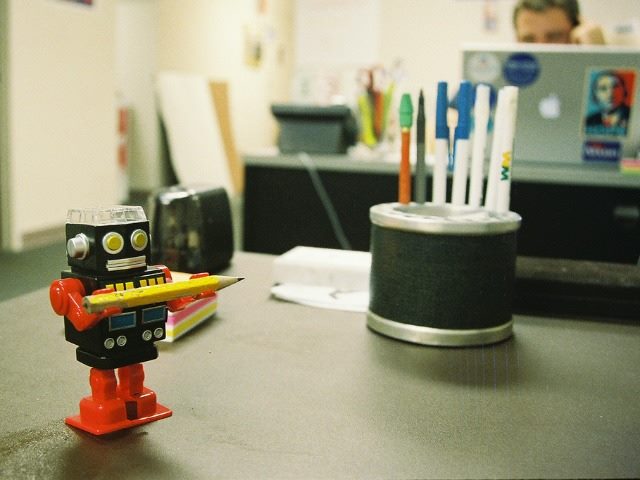 robot holding pencil